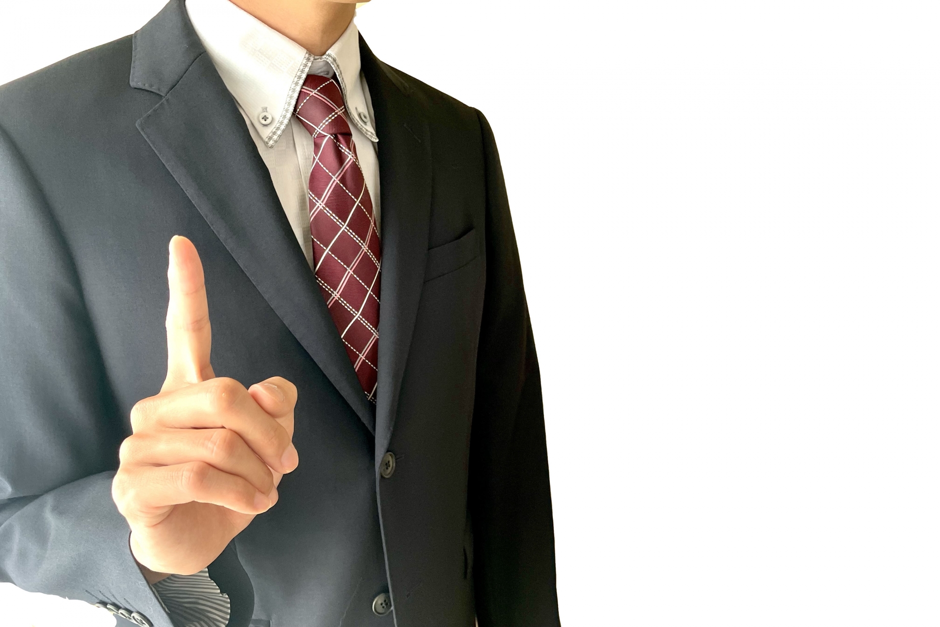 人差し指を立てているビジネスマン